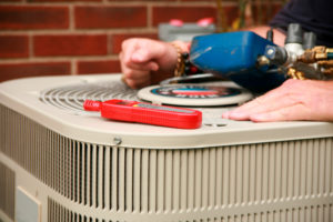 residential AC unit being repaired