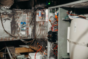 exposed wiring of furnace system in attic.