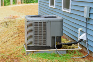 New outdoor air conditioning unit outside of a blue home in Texas